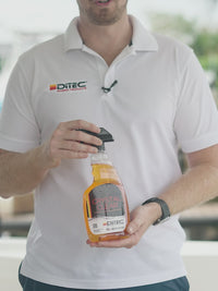 Man using ditech's crystal clear marine glass cleaner and degreaser