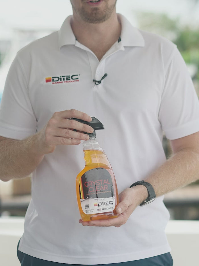 Man using ditech's crystal clear marine glass cleaner and degreaser