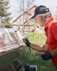 man applying non cracking PROTEC 1 paint and gelcoat protectant from Ditec