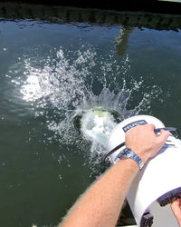 Rinsing DiTEC Elite Boat Wash biodegradable cleaner into waterways