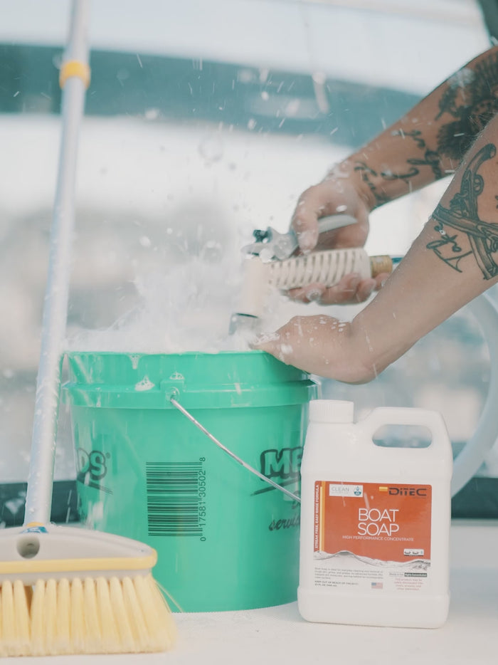 Man filling bucket with water from a hose and Boat Soap, eco friendly boat cleaner from DiTEC Marine Products