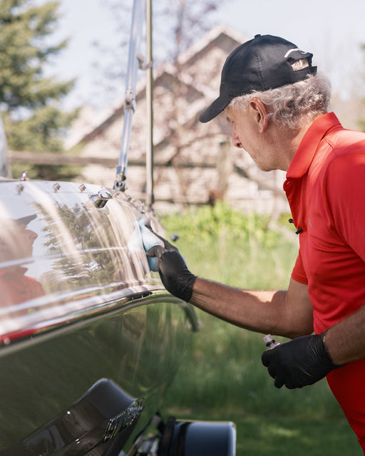 Man applying PROTEC 1 from DiTEC to speed boat exterior surface.